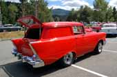 Super-cool custom 1957 Chevy Sedan Delivery looks great in perfect bright red paint job