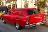 Photo shows classic chevy fins on the rear end of a stunningly restored 1957 chevrolet sedan delivery